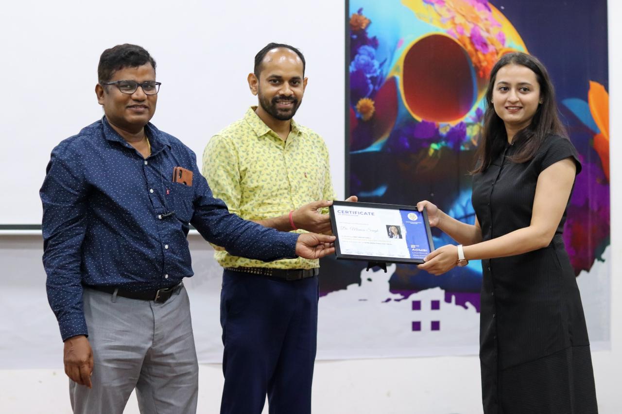Receiving the certificate · 2nd AOMSI Odisha State Chapter