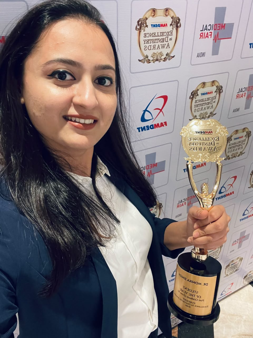 Dr Monika Singh Soni with the Famdent trophy